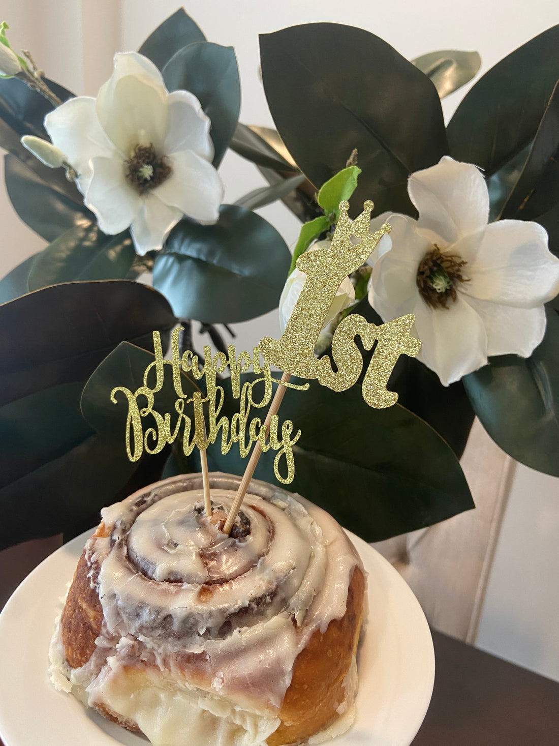 Birthday flowers and cinnamon roll